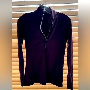 Nike dri fit, half zip, monkey sleeves, dark purple with neon pink accents.